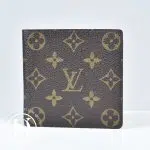 Portefeuille compact en toile monogram - Louis Vuitton Dressingment Votre